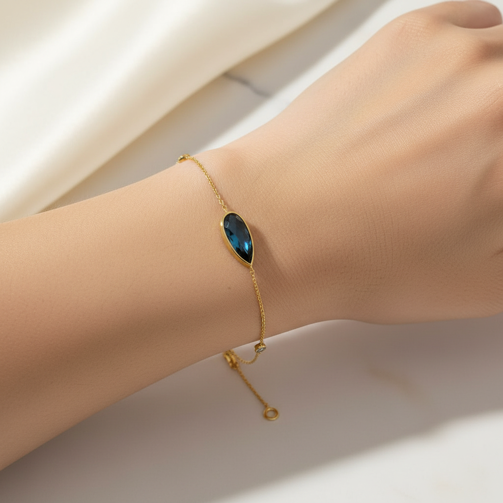 Goldarmband 14 KT. Mit Dunkelblauem Topas Tropfenstein