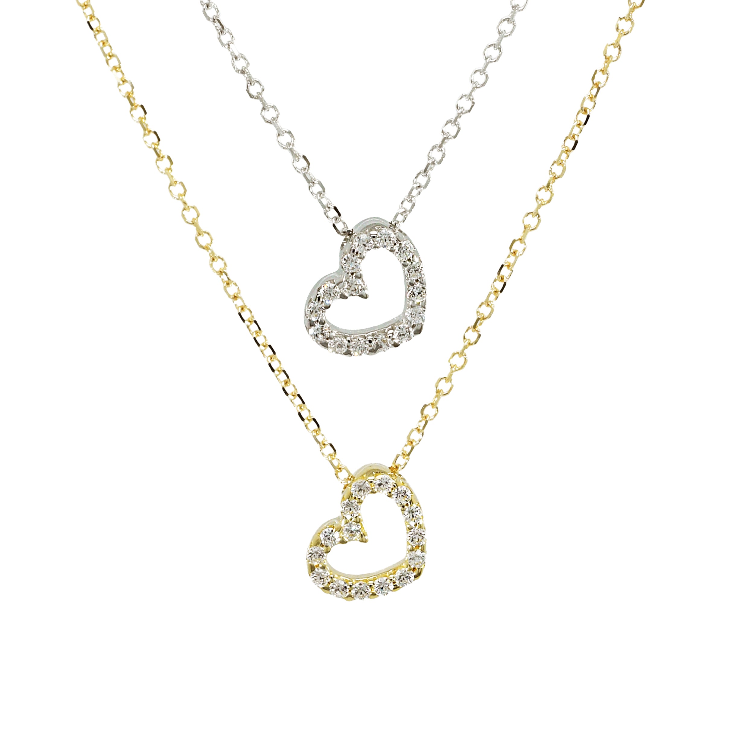 Zwei Ketten mit Herzanhänger, eine in Gelbgold, eine in Weißgold, beide mit Zirkoniasteinen gefasst, nebeneinander präsentiert.