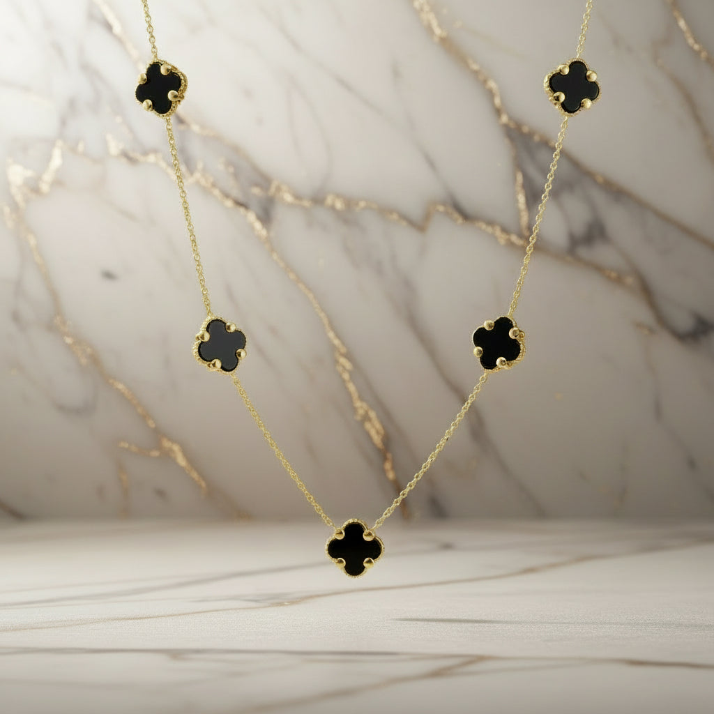 Goldkette mit fünf Onyx-Elementen in Vierpassform

