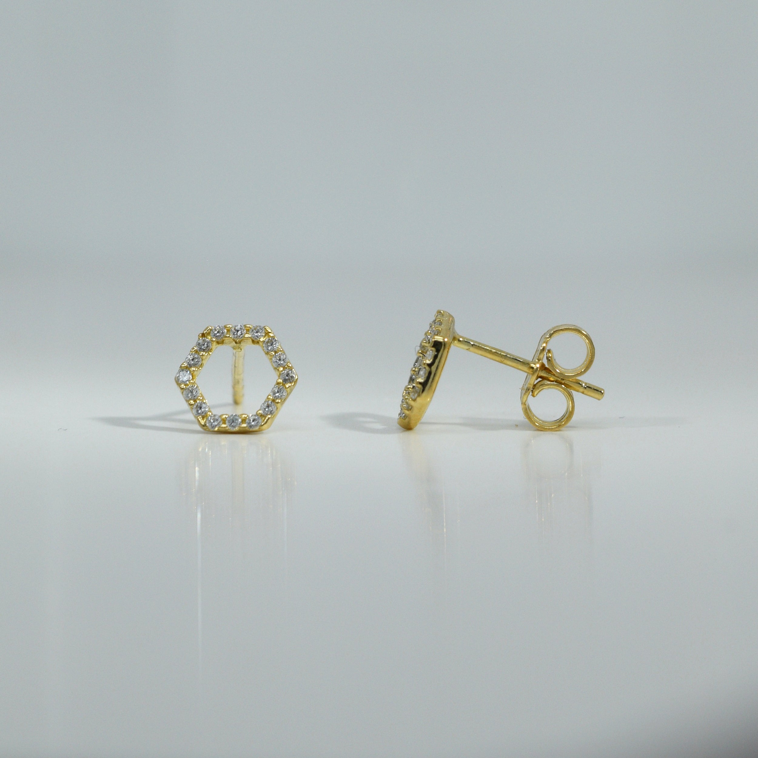 Ohrstecker aus Gelbgold in sechseckiger Form mit Zirkonia

