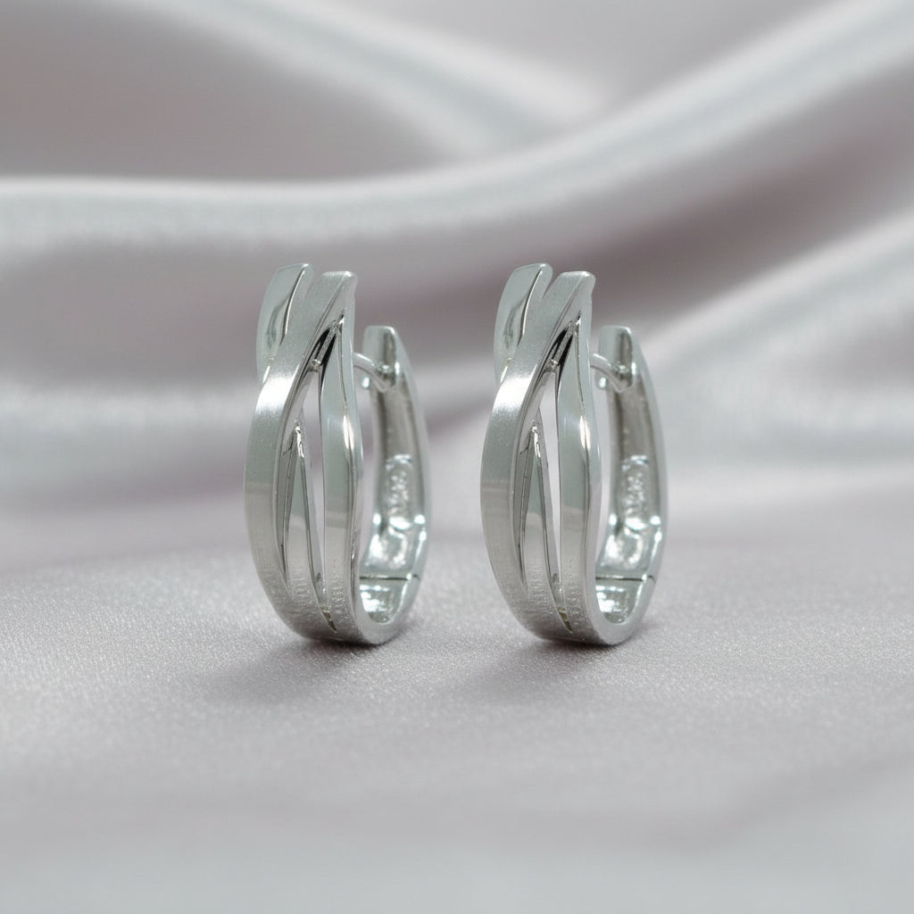 Splendido CRSU26 geschwungene Creolen aus rhodiniertem 925er Sterling Silber mit überkreuzten Bändern.

