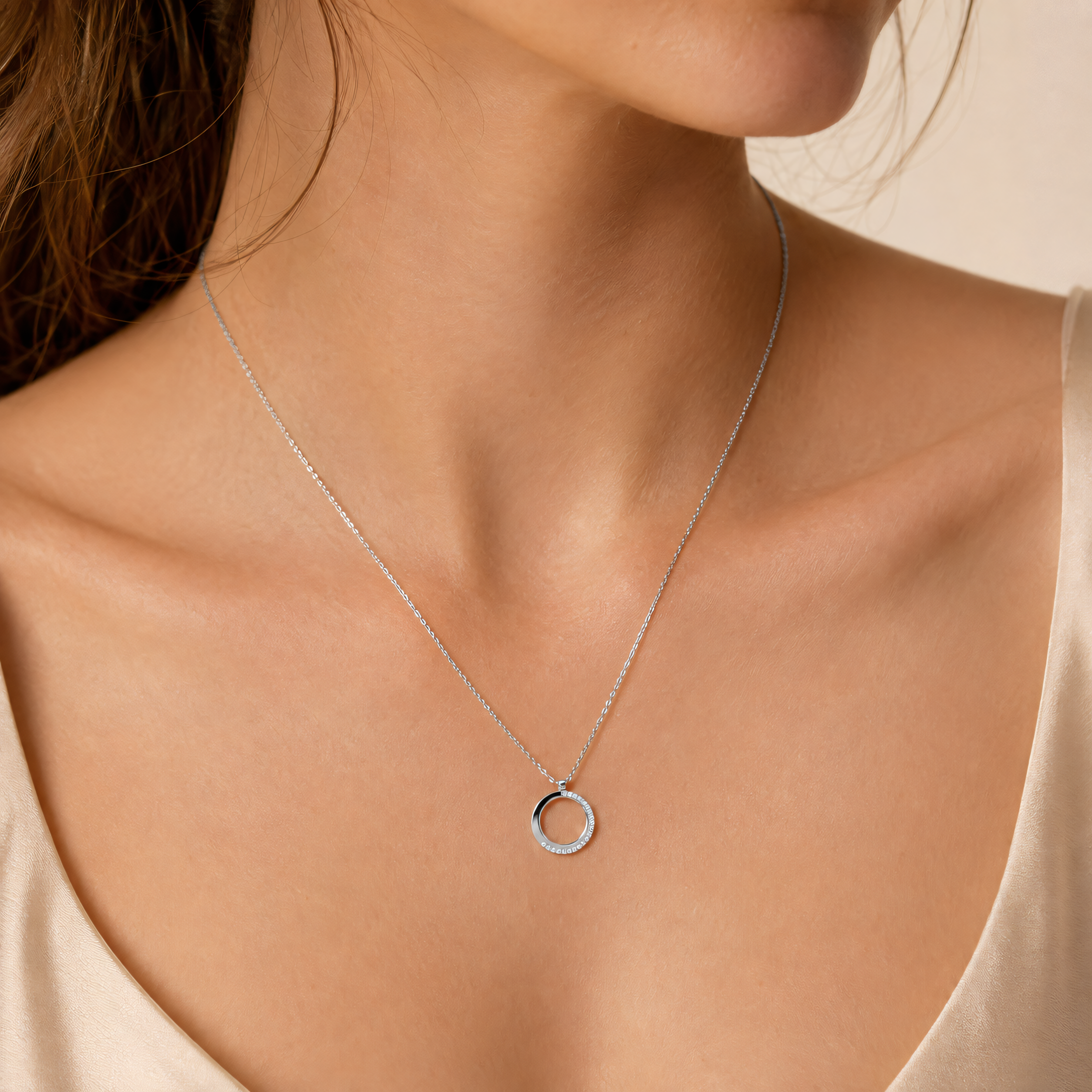 585 white gold necklace with 0,12 ct diamonds and circle pendant, worn on the neck